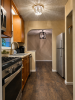 Galley kitchen with hard wood floors