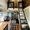 View of galley kitchen with stairs to the lofted area