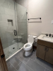 Bathroom with tile shower and vanity sink
