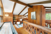 Interior upstairs view with wooden stairrails