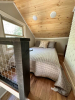 Loft with bed and nightstand