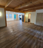 Living room with honey wood floors and view 