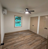 Bedroom with new hardwood floors and large closets