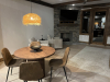 Dining area with table and view of living room