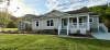 Exterior of home with light color paint and front porch