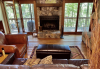 Living Area with stone fireplace and leather furniture