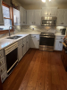 Kitchen with white cabinets and appliances