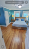 Bedroom with queen bed and bright blue walls