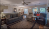 Living Area with two couches and windows in the background