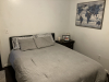 Bedroom with bed and wall art
