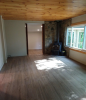 Living Room with wood floors and wood stove