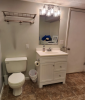 Bathroom with vanity sink and washer and dryer