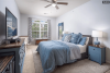 Bedroom with dresser and large window