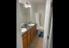 master bathroom with sink and tub