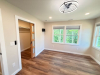 Primary Bedroom with hardwood floors