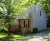 Blue home exterior with deck