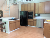 Kitchen with spiral staircase in the background