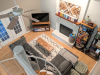 Overhead view of living area with fireplace and french doors leading to patio