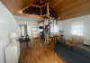 Living area with spiral staircase