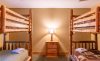 Bedroom with log frame bunk beds