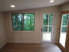 Sunroom with wood floors and wood view